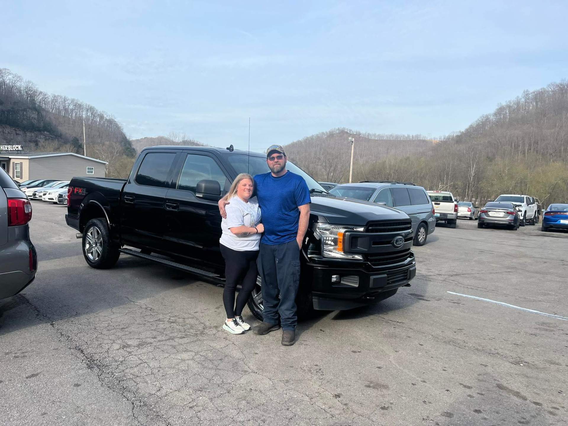 Happy customer taking delivery at Pop Chevrolet with Nathan Hall