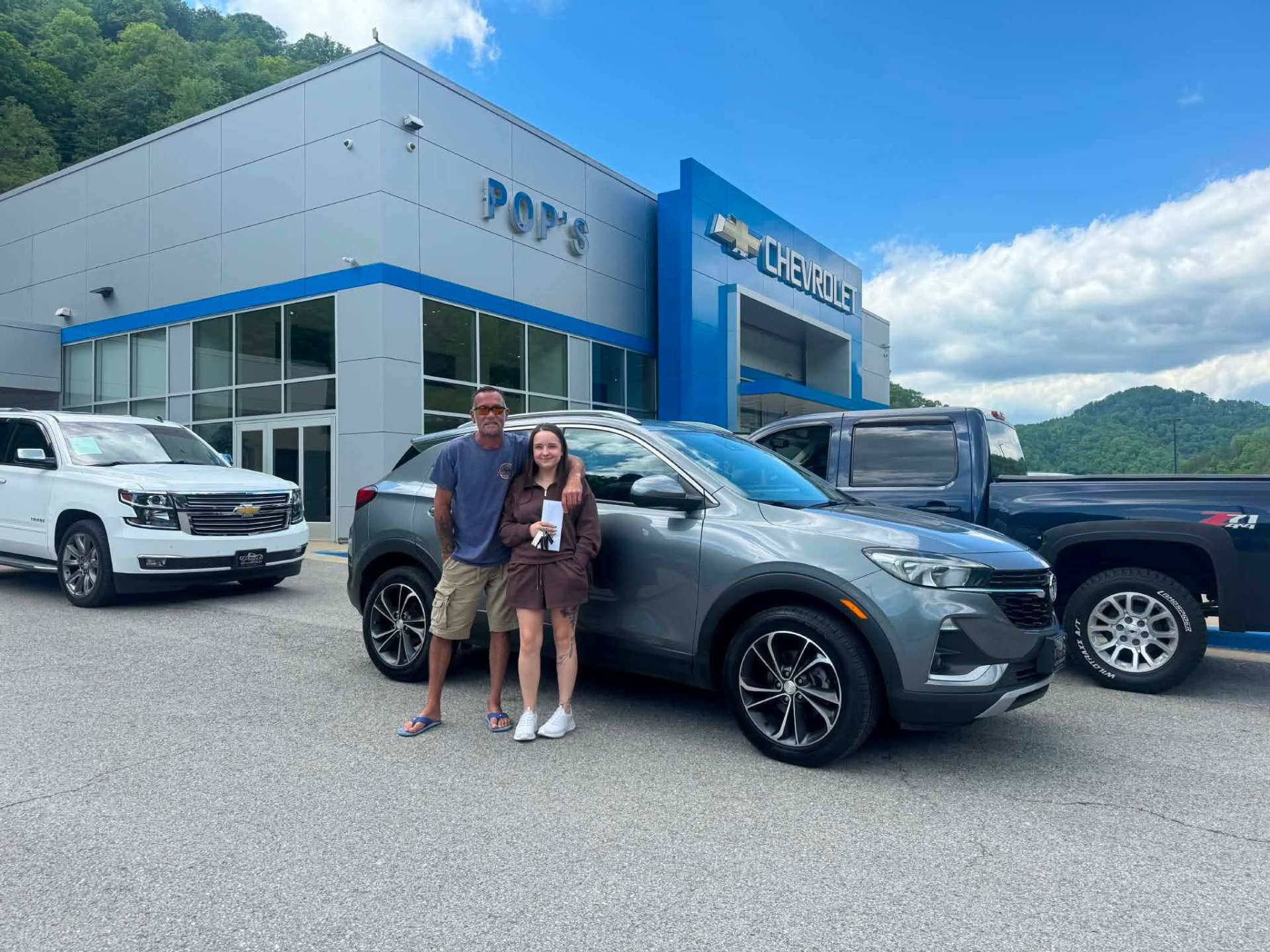 Happy customer taking delivery at Pop Chevrolet with Nathan Hall